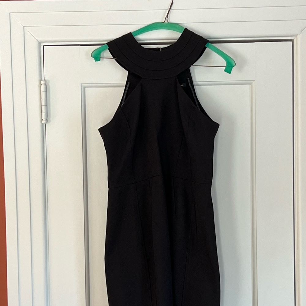 Cut away, fitted, black dress.